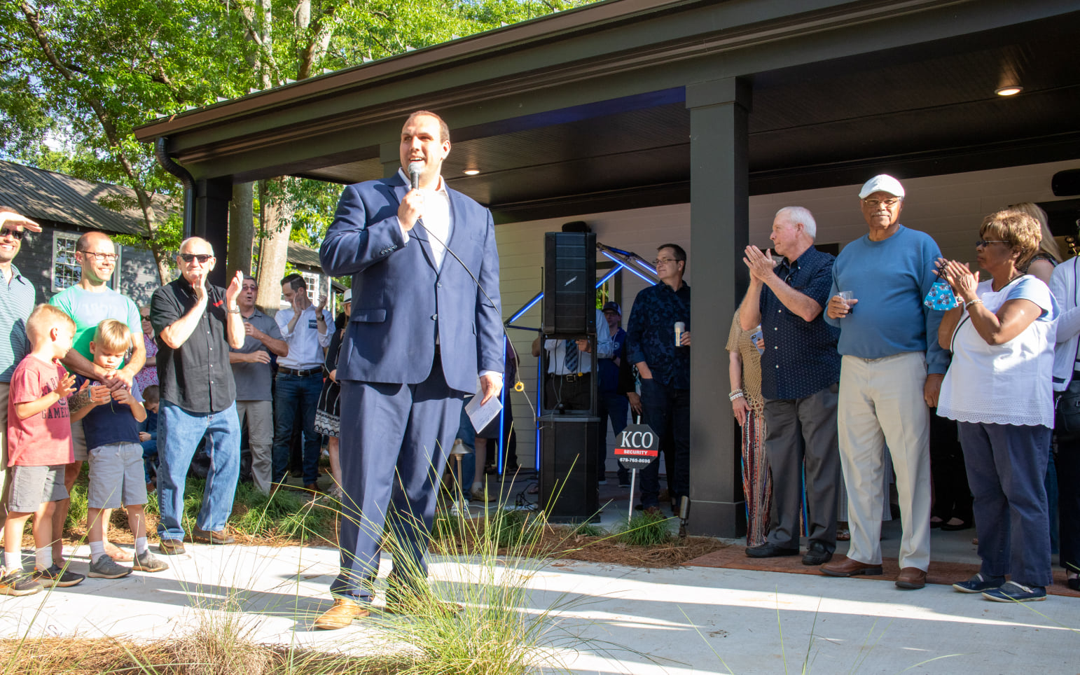 Elm Street Cultural Arts Village Executive Director Christopher Brazelton speaks at the opening of the Reeves House Visual Arts Center in downtown Woodstock. Special - Rebecca Blackwell